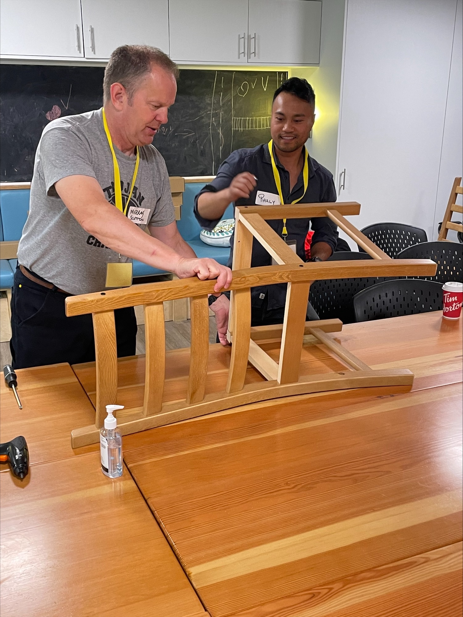 CREB® REALTORS® fix a chair at Discovery House